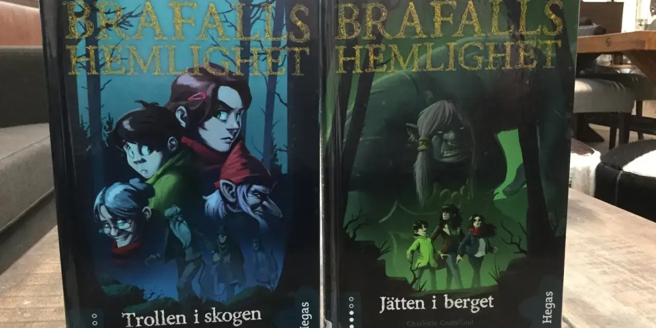 Två böcker, "Trollen i skogen" och "Jätten i berget", med fantasifulla illustrationer. Ett allegori exempel på äventyr.